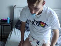 young-padded-boy-with-pacifier-wears-sweet-diaper-fills-her